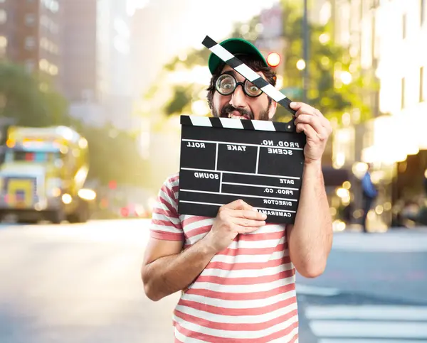 Ανόητος τρελός άνθρωπος με clapperboard — Φωτογραφία Αρχείου