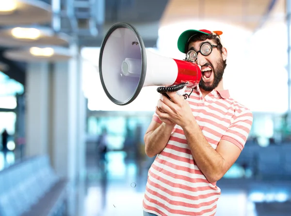 Verrückter junger Mann mit Megafon — Stockfoto