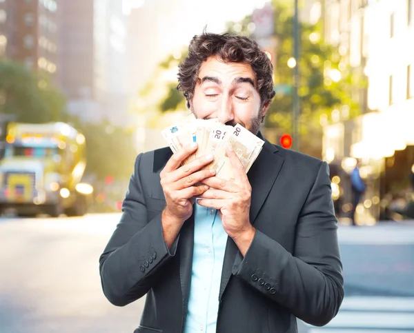Crazy businessman with banknotes — Stock Photo, Image