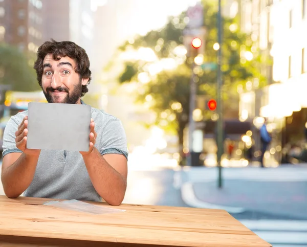 Homme à table avec carte grise — Photo