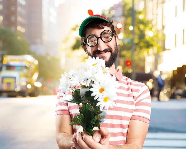 fool crazy man with bouquet of flowers