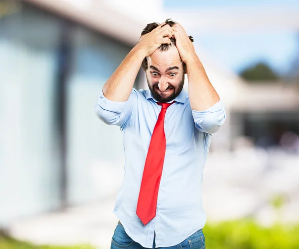 Crazy businessman with worried expression — Stock Photo, Image