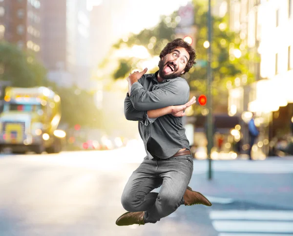 Crazy man jumping with happy expression — Stock Photo, Image