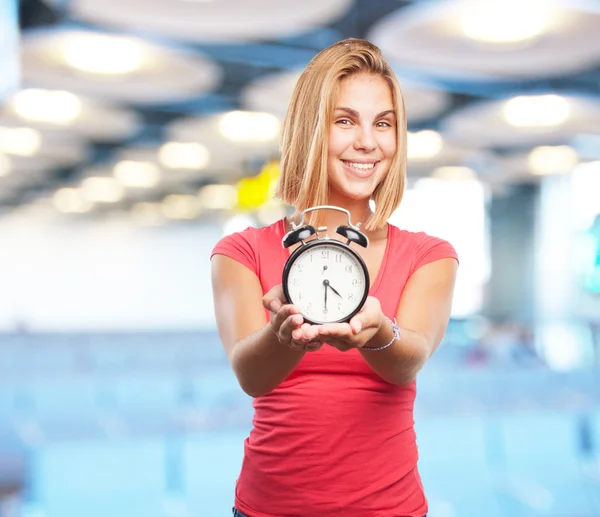 Young blond girl with alarm clock — Stock Photo, Image