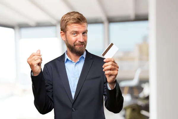 Blond businessman with credit card — Stock Photo, Image