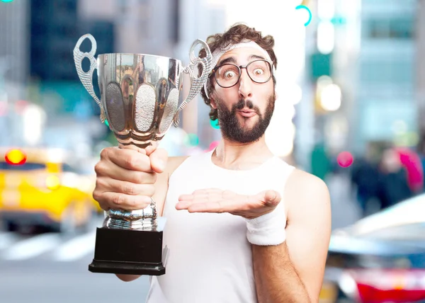 Crazy sportsman with sport cup — Stock Photo, Image