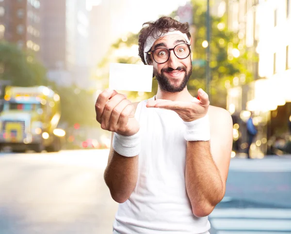 Junger verrückter Sportler mit Visitenkarte — Stockfoto