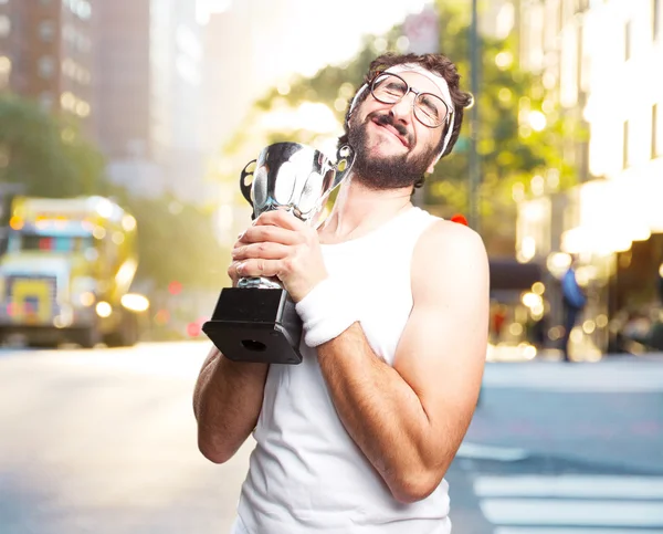 Crazy sportsman with sport cup — Stock Photo, Image