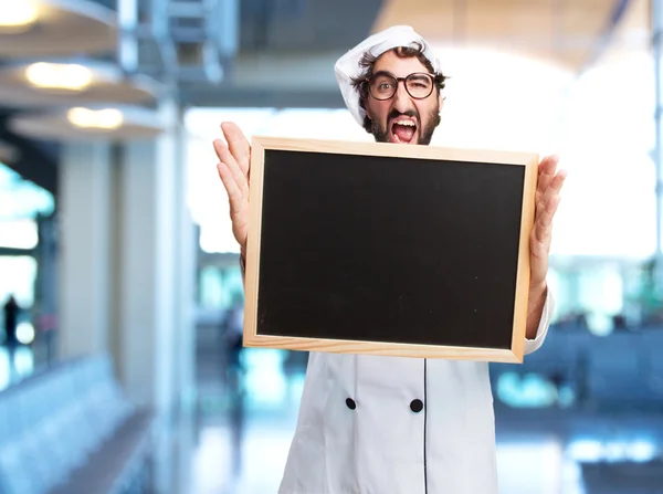 Crazy chef with wooden board — Stock Photo, Image