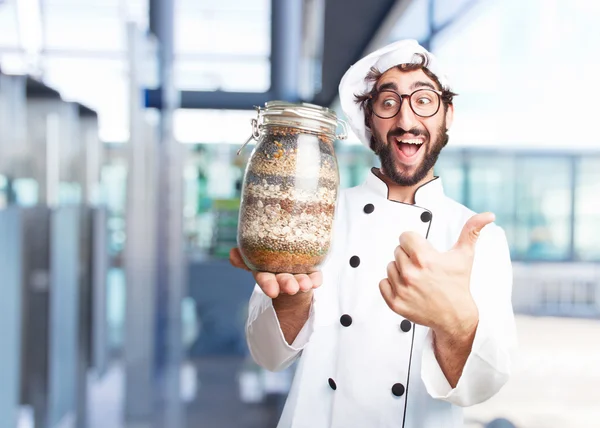 crazy chef with a jar with ingredients