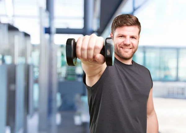 Joven deportista con mancuerna — Foto de Stock