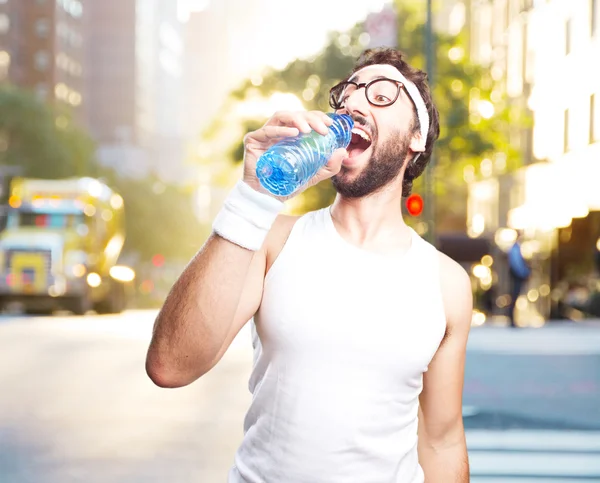 Joven deportista loco con botella de agua —  Fotos de Stock