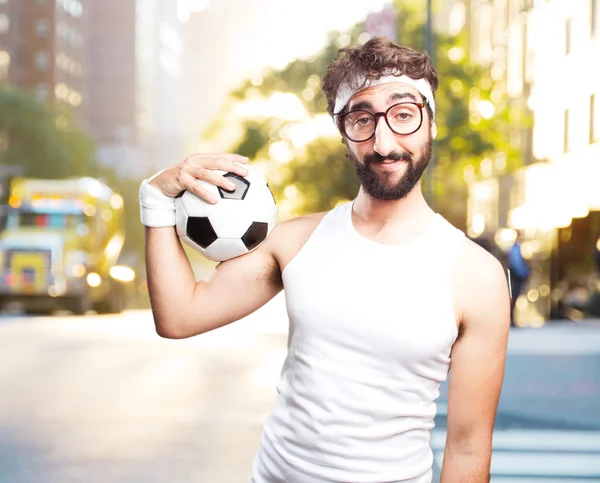 Young crazy sportsman with football ball — Stock Photo, Image