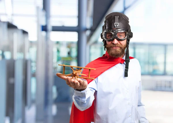 Blonder Held Mann mit Spielzeugflugzeug — Stockfoto