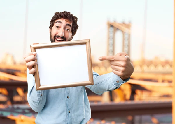 Jungunternehmer mit Kunstrahmen — Stockfoto