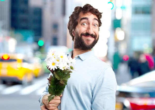 Joven con ramo de flores —  Fotos de Stock