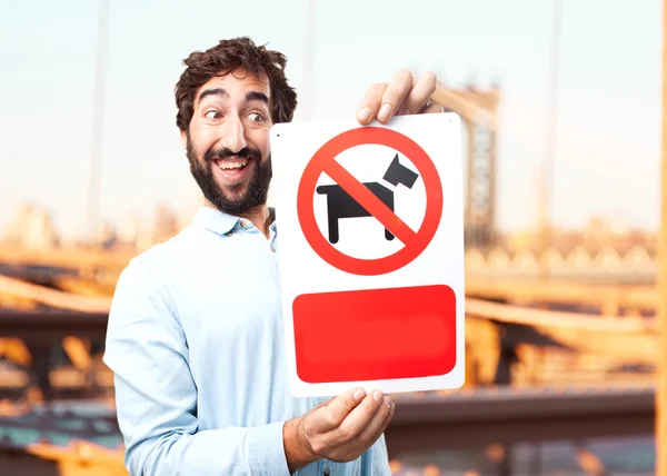 Joven hombre de negocios con signo anti perro — Foto de Stock