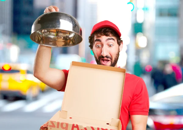 Crazy dealer with pizza and cap — Stock Photo, Image