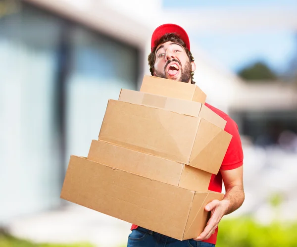 Joven loco con cajas —  Fotos de Stock