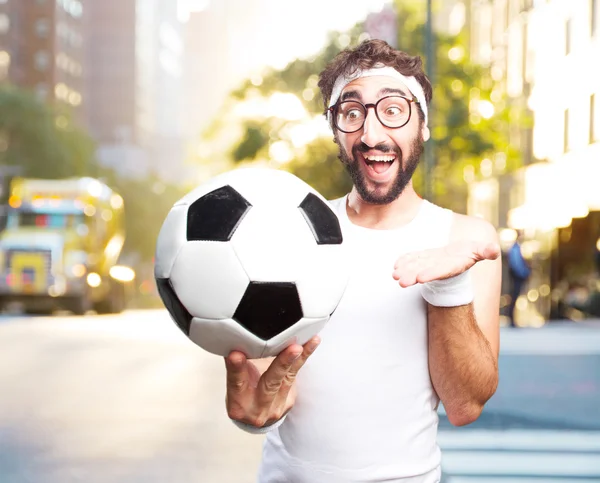 Young crazy sportsman with football ball — Stock Photo, Image