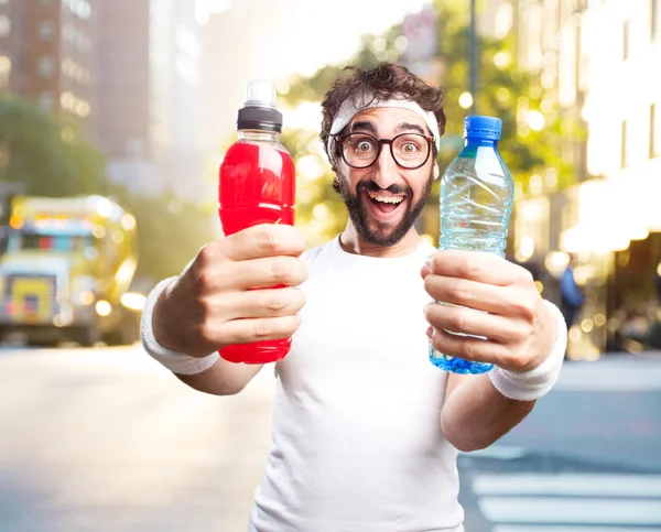 Young crazy sportsman with bottles — Stock Photo, Image
