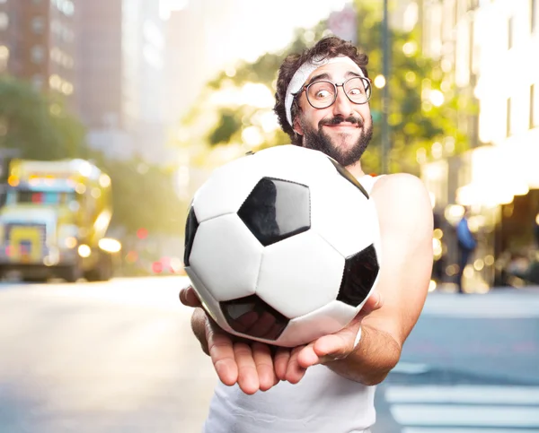 Young crazy sportsman with football ball — Stock Photo, Image