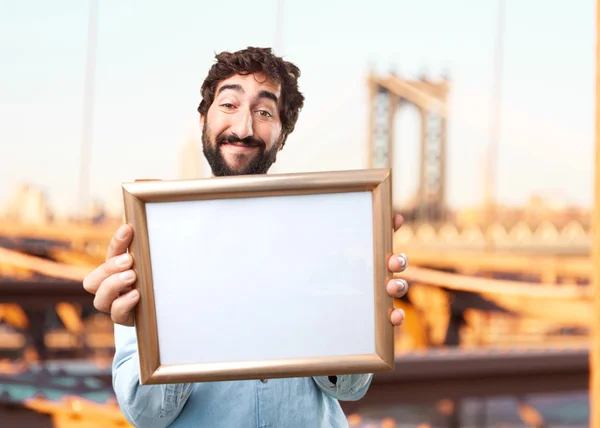 Young businessman with art frame — Stock Photo, Image