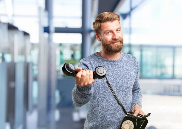 Homme blond avec téléphone rétro — Photo