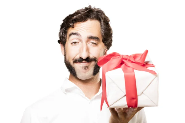 Young cool man with a gift — Stock Photo, Image