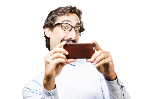 Joven hombre fresco con un teléfono móvil —  Fotos de Stock