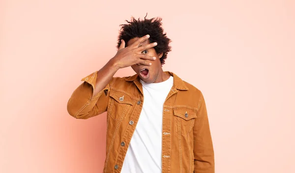 Young Black Afro Man Looking Shocked Scared Terrified Covering Face — Stock Photo, Image