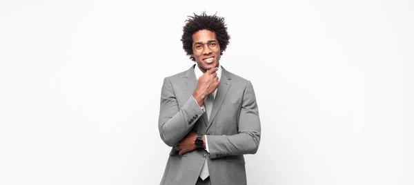 Black Afro Businessmanlooking Happy Smiling Hand Chin Wondering Asking Question — Stock Photo, Image