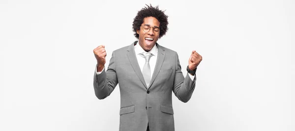 Black Afro Businessmanlooking Extremely Happy Surprised Celebrating Success Shouting Jumping — Stock Photo, Image