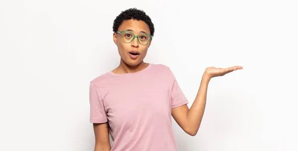 Afro Young Black Woman Looking Surprised Shocked Jaw Dropped Holding — Stock Photo, Image