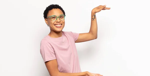 Afro Young Black Woman Holding Object Both Hands Side Copy — Stock Photo, Image