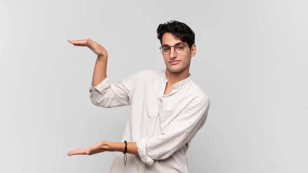 Young Handsome Man Holding Object Both Hands Side Copy Space — Stock Photo, Image