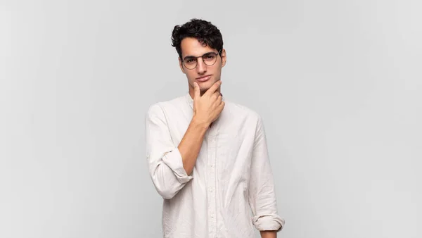 Young Handsome Man Looking Serious Thoughtful Distrustful One Arm Crossed — Stock Photo, Image