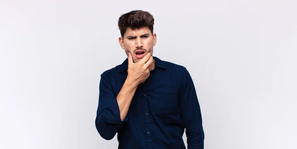 Young Handsome Man Mouth Eyes Wide Open Hand Chin Feeling — Stock Photo, Image