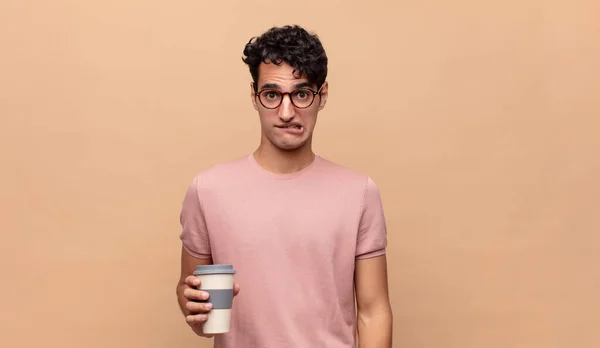 Young Handsome Man Coffee Looking Puzzled Confused Biting Lip Nervous — Stock Photo, Image