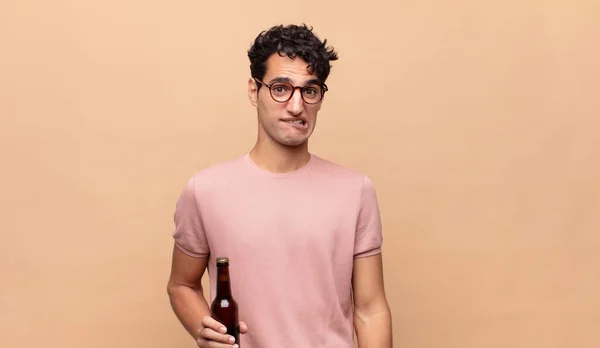 Young Man Beer Looking Puzzled Confused Biting Lip Nervous Gesture — Stock Photo, Image