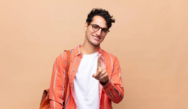 Young Student Smiling Proudly Confidently Making Number One Pose Triumphantly — Stock Photo, Image