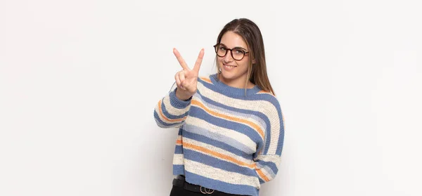 Young Blonde Woman Smiling Looking Happy Carefree Positive Gesturing Victory — Stock Photo, Image