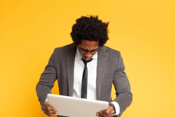 young black businessman with a laptop