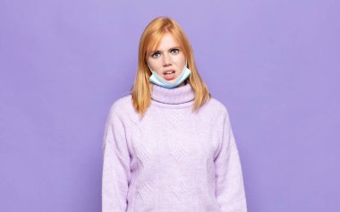 pretty woman  feeling puzzled and confused, with a dumb, stunned expression looking at something unexpected