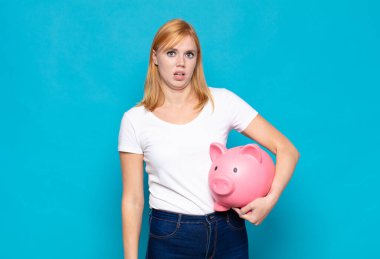 pretty woman  feeling puzzled and confused, with a dumb, stunned expression looking at something unexpected