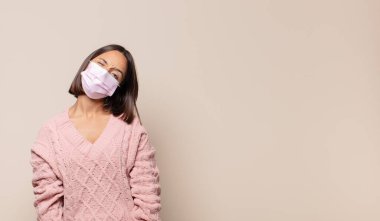 young woman feeling puzzled and confused, with a dumb, stunned expression looking at something unexpected