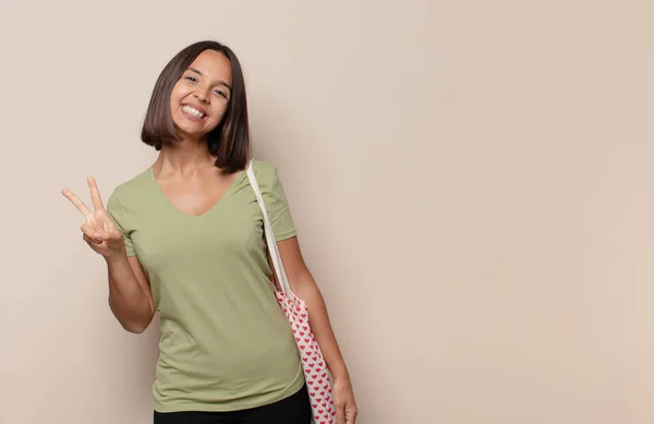 Young Woman Smiling Looking Happy Carefree Positive Gesturing Victory Peace — Stock Photo, Image