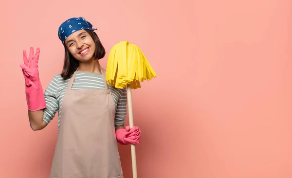 Young Woman Housekeeper Smiling Looking Friendly Showing Number Three Third — Stock Photo, Image