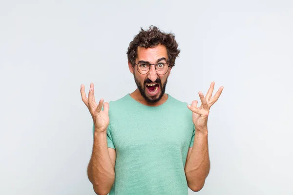 Young Bearded Man Screaming Hands Air Feeling Furious Frustrated Stressed — Stock Photo, Image