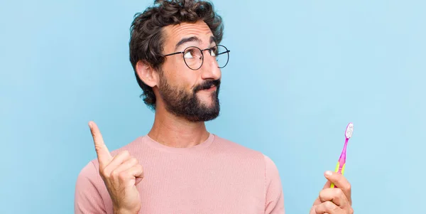 Young Bearded Man Smiling Happily Looking Sideways Wondering Thinking Having — Stock Photo, Image